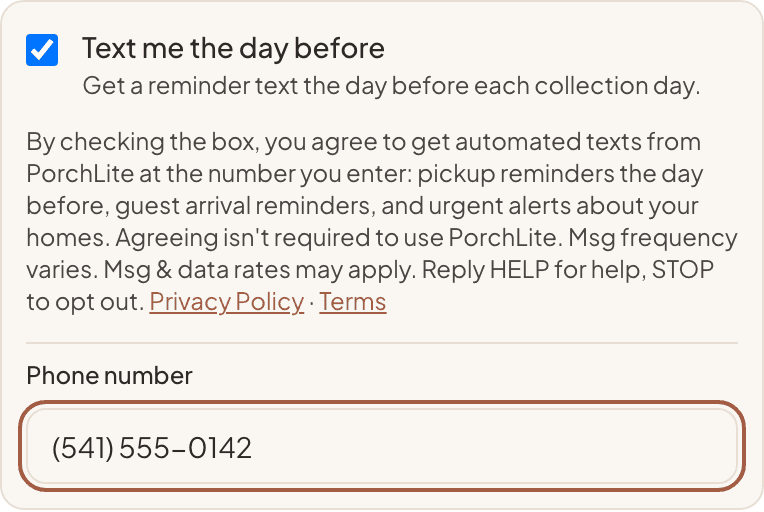 Screenshot of the same opt-in after checking "Text me the day before": a phone number field appears under the disclosure.